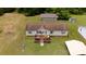 Aerial view of the home showing the front yard, driveway, and surrounding trees at 1007 W Cabaniss Rd, Shelby, NC 28150