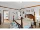 Bedroom featuring a bed with pillows, with an ensuite bathroom door at 1007 W Cabaniss Rd, Shelby, NC 28150