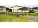 This property features a metal carport, offering convenient covered parking at 1007 W Cabaniss Rd, Shelby, NC 28150