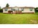 Charming home with a well-manicured lawn, inviting deck, and curb appeal at 1007 W Cabaniss Rd, Shelby, NC 28150
