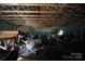 Large garage interior, showing exposed wooden rafters, block construction, and generous storage space at 1007 W Cabaniss Rd, Shelby, NC 28150