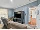 Cozy living room featuring a large TV and reclining chairs at 1007 W Cabaniss Rd, Shelby, NC 28150