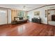 Inviting living room with hardwood floors, a comfortable couch, and lots of natural light at 1007 W Cabaniss Rd, Shelby, NC 28150