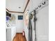 Convenient mud room with hooks, shelving, washer and dryer hookups is perfect for entry and laundry at 1007 W Cabaniss Rd, Shelby, NC 28150