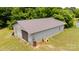 A detached outbuilding with a metal roof and roll up door at 1007 W Cabaniss Rd, Shelby, NC 28150