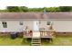 Outdoor deck with stairs and a railing, offering a private backyard view at 1007 W Cabaniss Rd, Shelby, NC 28150