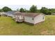 Back of house with a wooden deck overlooking the grassy backyard space at 1007 W Cabaniss Rd, Shelby, NC 28150