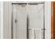 Shower enclosed with sliding glass door with chrome trim and hardware at 1007 W Cabaniss Rd, Shelby, NC 28150