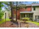 Enjoy the outdoors in this backyard with beautiful landscaping, mature trees, and a tranquil screened porch at 1035 Wexford Nw Pl, Concord, NC 28027