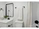 Modern bathroom featuring sleek black fixtures, a stylish shower curtain, and ample storage at 1035 Wexford Nw Pl, Concord, NC 28027