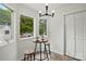 Cozy dining area with a round table, stools, and natural light at 1035 Wexford Nw Pl, Concord, NC 28027