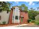 Charming brick townhome with a bay window and verdant landscaping at 1035 Wexford Nw Pl, Concord, NC 28027