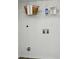 This laundry room features white walls, wire shelving, and plumbing hookups for laundry appliances at 1035 Wexford Nw Pl, Concord, NC 28027