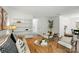 Inviting living room featuring a bookshelf, modern seating, and hardwood floors at 1035 Wexford Nw Pl, Concord, NC 28027