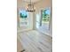 Bright dining area with modern chandelier, large windows, and new flooring at 120 Autumn Blaze Rd, China Grove, NC 28023
