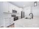 Modern kitchen with stainless steel appliances, quartz countertops and a center island at 120 Autumn Blaze Rd, China Grove, NC 28023