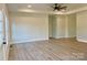Spacious living room with new flooring, ceiling fan, recessed lighting, and ample natural light at 120 Autumn Blaze Rd, China Grove, NC 28023