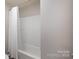 Shower-tub combination, white shower curtain, and practical design for a clean and functional bathroom space at 1211 Gold Rush Ct, Fort Mill, SC 29708