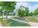 Charming two-story home with manicured lawn, lush landscaping, and inviting curb appeal at 1211 Gold Rush Ct, Fort Mill, SC 29708