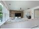 Bright living room with many windows, plank floors, and views to an adjacent dining room at 1211 Gold Rush Ct, Fort Mill, SC 29708