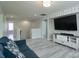 Upstairs living area includes a large wall-mounted TV, comfortable sofa, and easy access to other rooms at 1211 Gold Rush Ct, Fort Mill, SC 29708