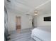 Large main bedroom showcasing tray ceilings, hardwood floors, and ensuite bathroom at 1211 Gold Rush Ct, Fort Mill, SC 29708