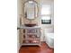 Powder room features a decorative sink, marble countertop, and custom cabinetry at 1220 Broadside Rd, York, SC 29745