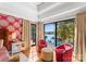 The bedroom offers a sitting area and access to breathtaking views of the lake at 1220 Broadside Rd, York, SC 29745