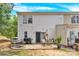 Charming backyard patio with grill, table, chairs and a cozy outdoor seating area perfect for relaxation at 125 Lynch Cir, Mooresville, NC 28117