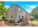 The backyard has a patio area complete with seating and a grill, perfect for entertaining guests outdoors at 125 Lynch Cir, Mooresville, NC 28117