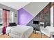 This bedroom has colorful painted walls, a bed, a window with blinds, and a TV at 125 Lynch Cir, Mooresville, NC 28117