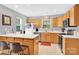 Bright kitchen features wood cabinets, modern appliances, and a breakfast bar for casual dining at 125 Lynch Cir, Mooresville, NC 28117
