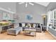 Spacious living room featuring a vaulted ceiling, large sectional, and a unique fish tank at 125 Lynch Cir, Mooresville, NC 28117