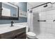 Modern bathroom features a sleek vanity, walk-in shower, and minimalist design, providing a clean and functional space at 1305 Creekview Dr, Gastonia, NC 28052