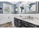Charming bathroom with a double vanity, marble countertop, and decorative tile flooring, offering a blend of style at 1305 Creekview Dr, Gastonia, NC 28052