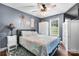 Inviting bedroom with stylish furniture, a ceiling fan, and a window, creating a comfortable and relaxing retreat at 1305 Creekview Dr, Gastonia, NC 28052