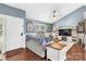 Bright and stylish living room with hardwood floors, vaulted ceilings, cozy furniture, and a decorative fireplace at 1305 Creekview Dr, Gastonia, NC 28052