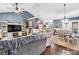 Open-concept living space featuring hardwood floors and comfortable seating, seamlessly connected to the dining area and kitchen at 1305 Creekview Dr, Gastonia, NC 28052