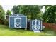 Two storage sheds in the backyard, one labeled as 