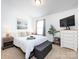 Well-lit bedroom with comfortable bedding and decorative accessories, providing a welcoming and relaxing atmosphere at 13422 Calloway Glen Dr, Charlotte, NC 28273