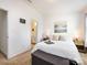 Cozy bedroom with a comfortable bed, stylish nightstands, and a view into the attached bathroom at 13422 Calloway Glen Dr, Charlotte, NC 28273