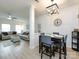 Dining area with a contemporary table set, modern lighting, and seamless flow into the living room at 13422 Calloway Glen Dr, Charlotte, NC 28273