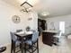 Dining area adjacent to the kitchen featuring a sleek table set and stylish accents at 13422 Calloway Glen Dr, Charlotte, NC 28273