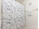 Bathroom featuring a shower with a stylish marble-patterned shower curtain at 13422 Calloway Glen Dr, Charlotte, NC 28273