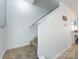 Carpeted stairs with white railing leading to the upper level, bright and airy, with neutral decor at 13422 Calloway Glen Dr, Charlotte, NC 28273