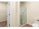 Well-lit bathroom featuring a glass-enclosed shower and neutral finishes at 1522 Doran Ter, Richburg, SC 29729