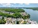 Picturesque aerial view of neighborhood homes near a tranquil lake at 161 Badin Lake Cir, New London, NC 28127