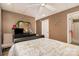 This bedroom features carpeted floors, dark wood furniture, and a ceiling fan at 161 Badin Lake Cir, New London, NC 28127