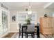 Bright dining area featuring a table with seating, a woven cabinet, and natural light at 161 Badin Lake Cir, New London, NC 28127