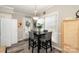 Charming dining area with a modern table set and natural light streaming through the window at 161 Badin Lake Cir, New London, NC 28127